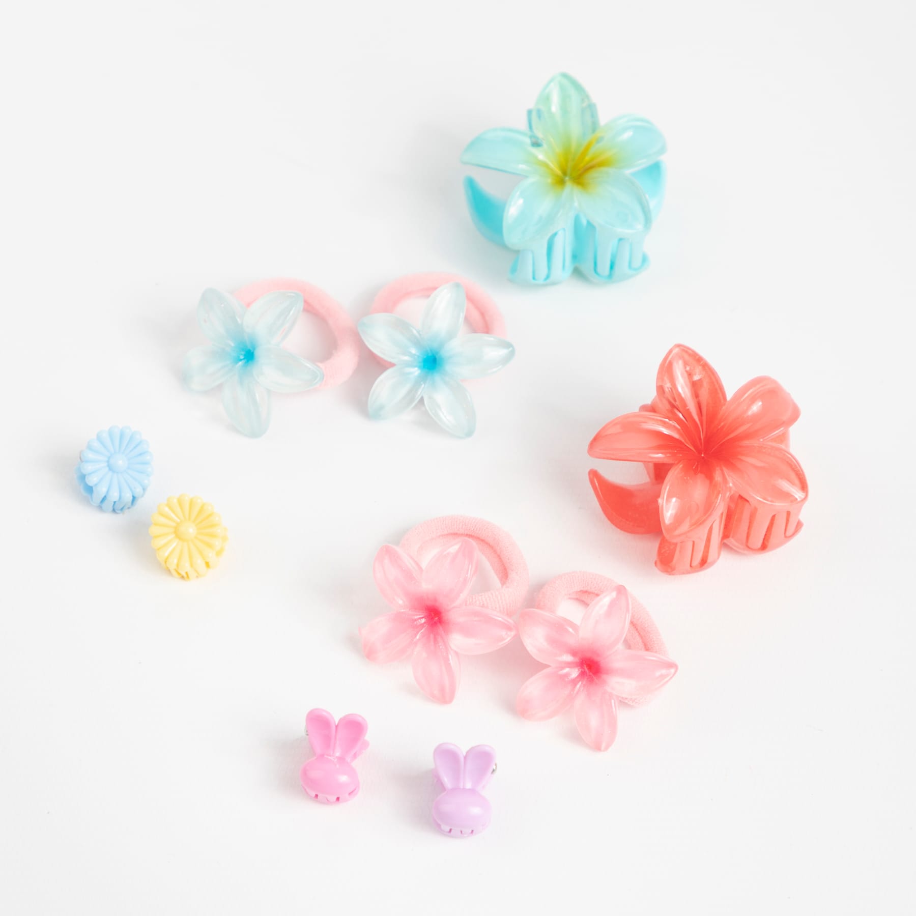 KIT DE HEBILLAS DE FLORES + GOMITAS DE COLORES
